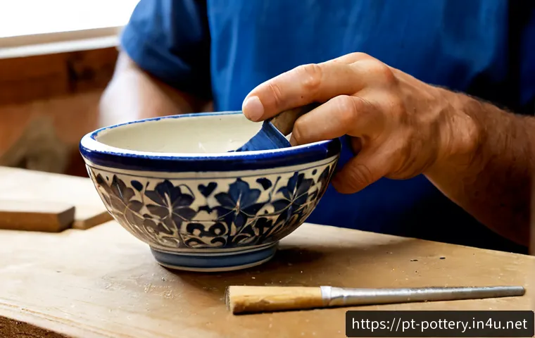 Home 17 도자기 복원 및 수리법 - Photorealistic close-up of a skilled ceramic restorer repairing a cracked Portuguese azulejo-style c...